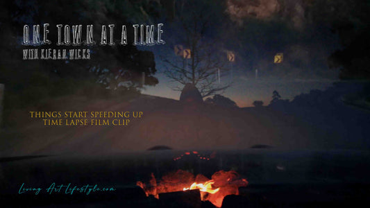 Things Start Speeding Up by Kieran Wicks - Time Lapse Film Clip - Still from film clip Kieran Wicks in front of camp fire super imposed over road